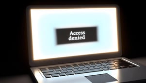 laptop screen showing access denied and unable to access a webpage