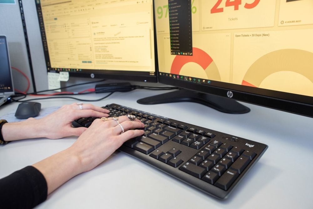 DP Solutions employee typing on a computer to support clients in Baltimore, MD