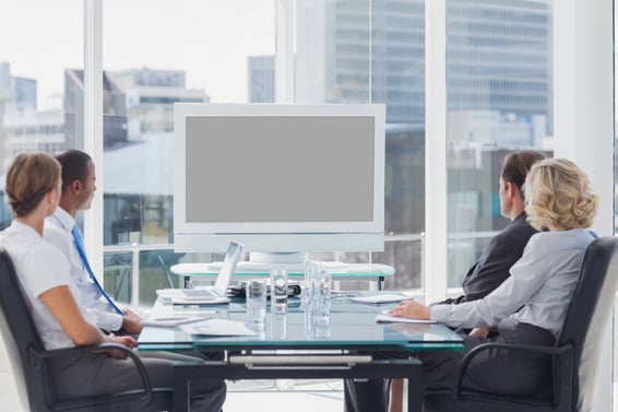 Group of business people looking at a screen during a video conference