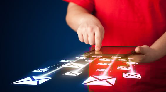 Hand holding tablet and sending email icons concept on background