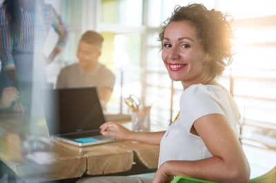 Image of a succesful casual business woman using laptop during meeting-1