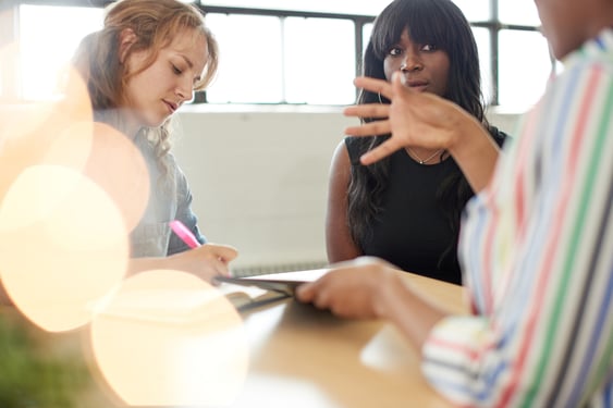 Unposed group of creative business people in an open concept office brainstorming their next project.-Nov-07-2025-06-25-44-8195-PM
